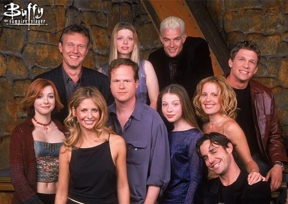 Joss Whedon surrounded by the Buffy cast